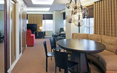 Living room with working station in a hotel suite at the Hilton Omaha.