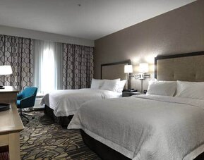 2 queen beds in suite with desk at the Hampton inn & Suites Ardmore.