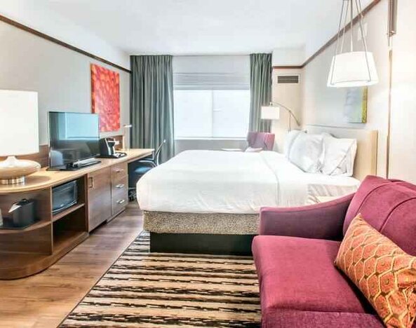 Bright and comfortable king guestroom at the Hilton Garden Inn Minneapolis Airport Mall of America.