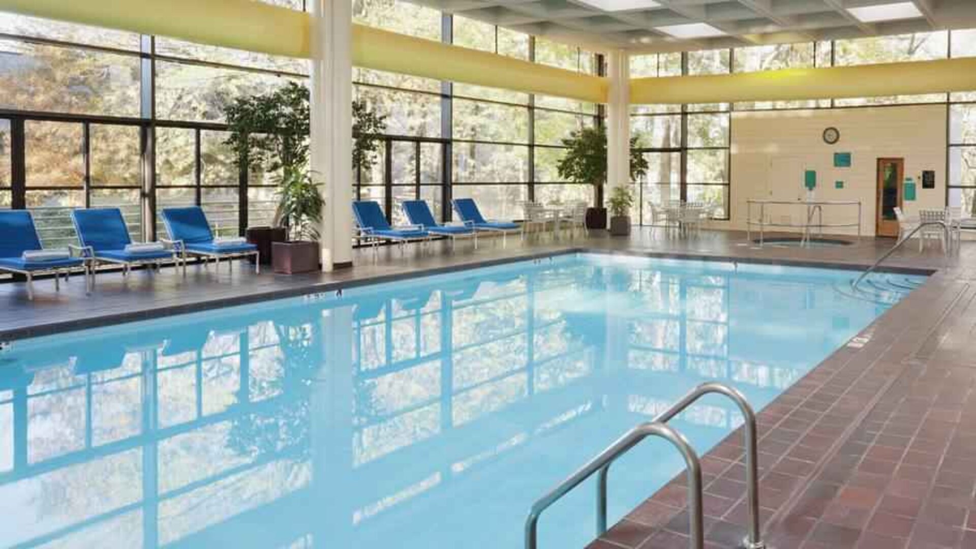 Relaxing indoor pool with lounges at the DoubleTree by Hilton Kansas City - Overland Park.