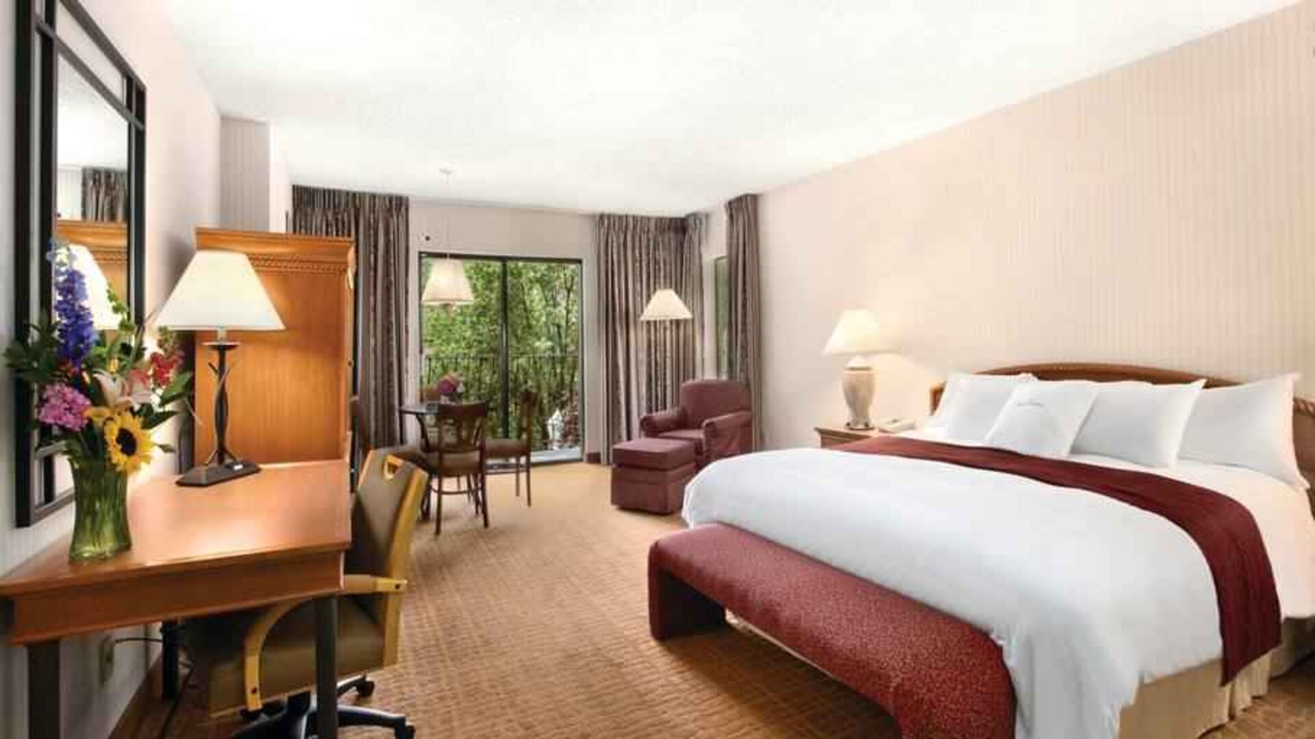 Bright hotel guestroom with window and king size bed at the DoubleTree by Hilton Durango.