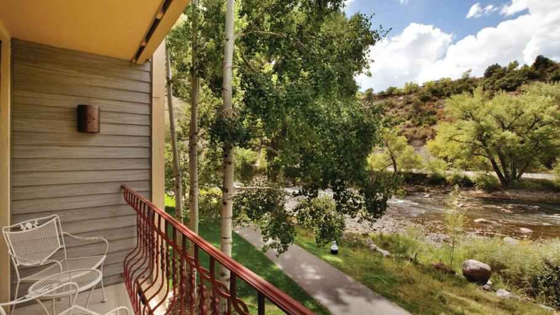 Bright hotel guestroom with window and king size bed at the DoubleTree by Hilton Durango.