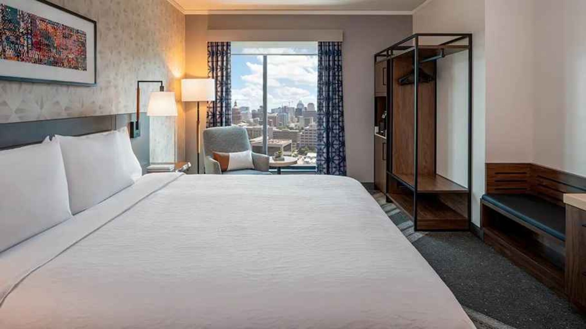 Spacious king suite with business desk and city views at Hilton Garden Inn Austin University.