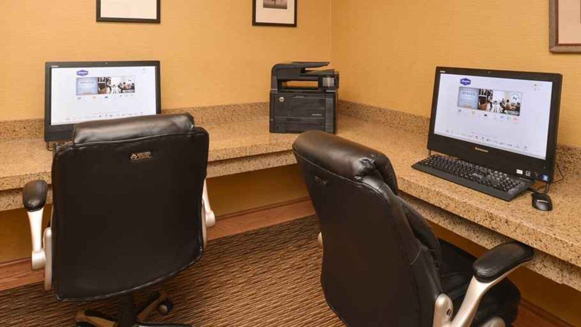 Dedicated business center with printer, computers, and internet at Hampton Inn & Suites Pueblo-Southgate.