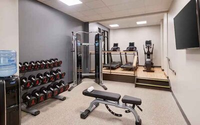 Weights and treadmills at the fitness center of the Embassy Suites by Hilton Tysons Corner.