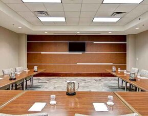 Elegant meeting room with screen at the Homewood Suites by Hilton Washington, D.C. Downtown.