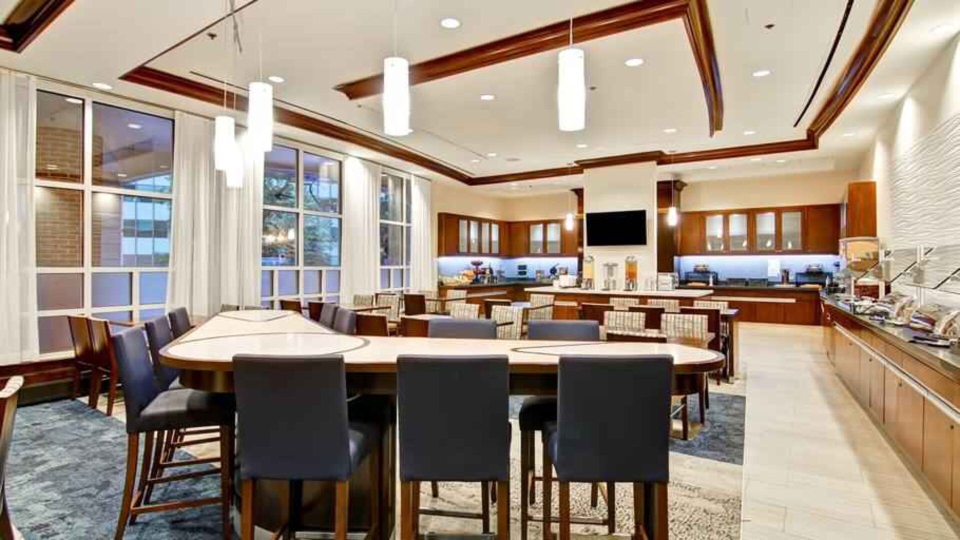 Large restaurant area perfect as workspace at the Homewood Suites by Hilton Washington, D.C. Downtown.