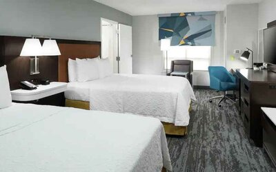 Double queen room with working station at the Hampton Inn & Suites Memphis-Beale Street.