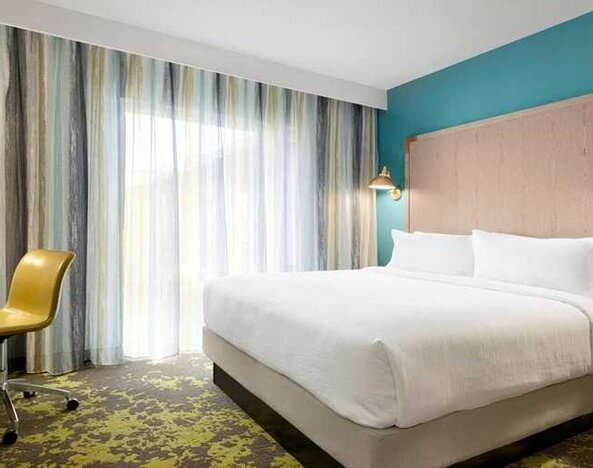 spacious king room with work desk ideal for working remotely at Embassy Suites by Hilton Boulder.