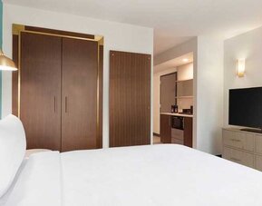 comfortable delux king room with TV at Embassy Suites by Hilton Boulder.