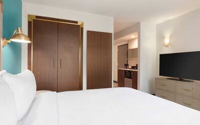 comfortable delux king room with TV at Embassy Suites by Hilton Boulder.