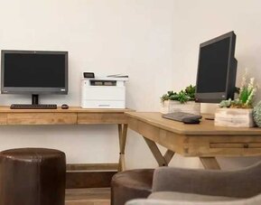 dedicated business center with printers, internet, and work desks ideal for working remotely at Embassy Suites by Hilton Boulder.