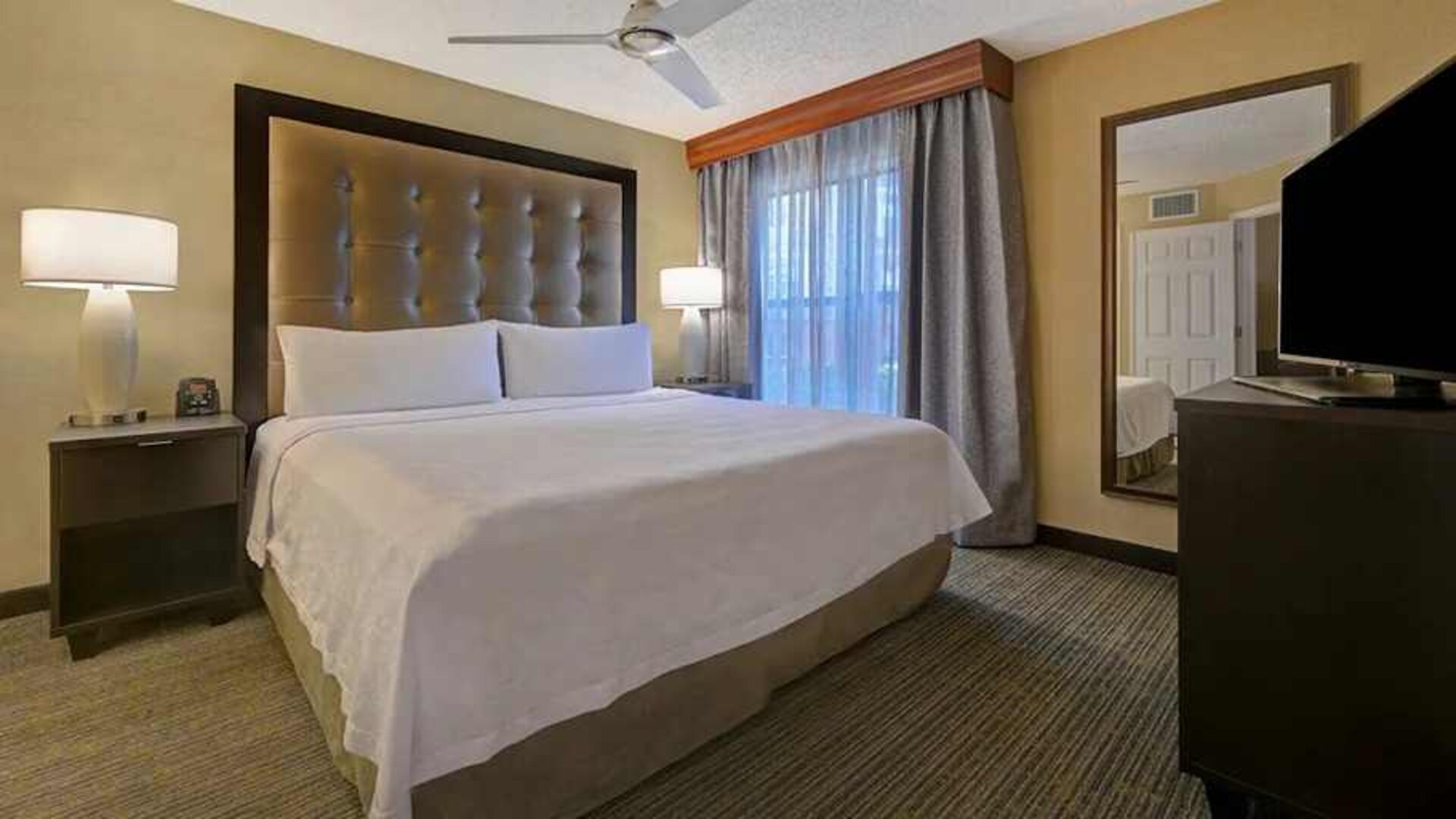 spacious king bed with TV at Homewood Suites by Hilton - Boulder.