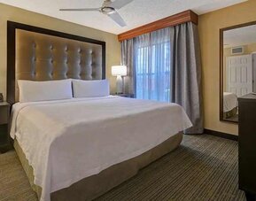 spacious king bed with TV at Homewood Suites by Hilton - Boulder.