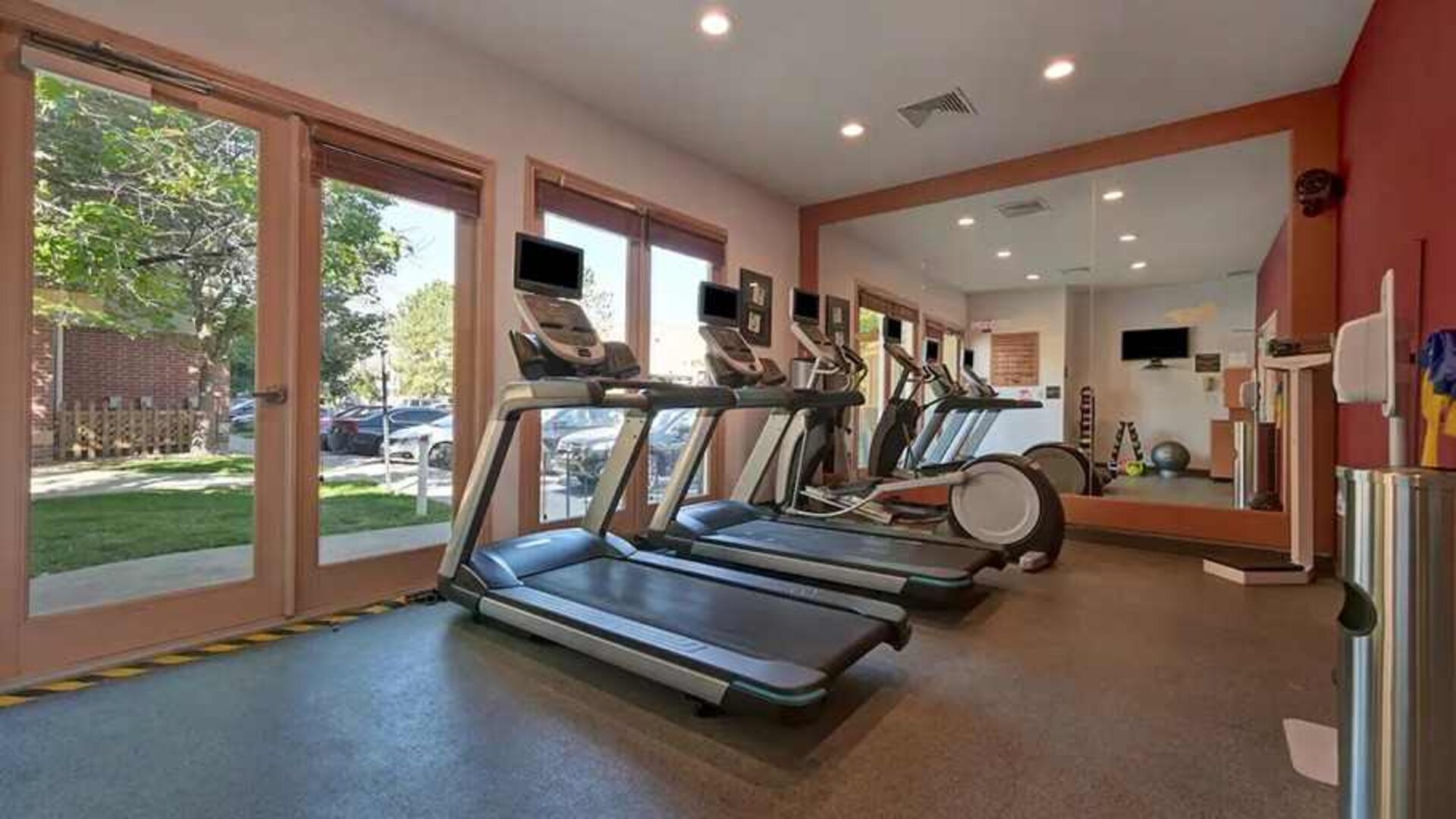 well-equipped fitness center with lots of natural light at Homewood Suites by Hilton - Boulder.