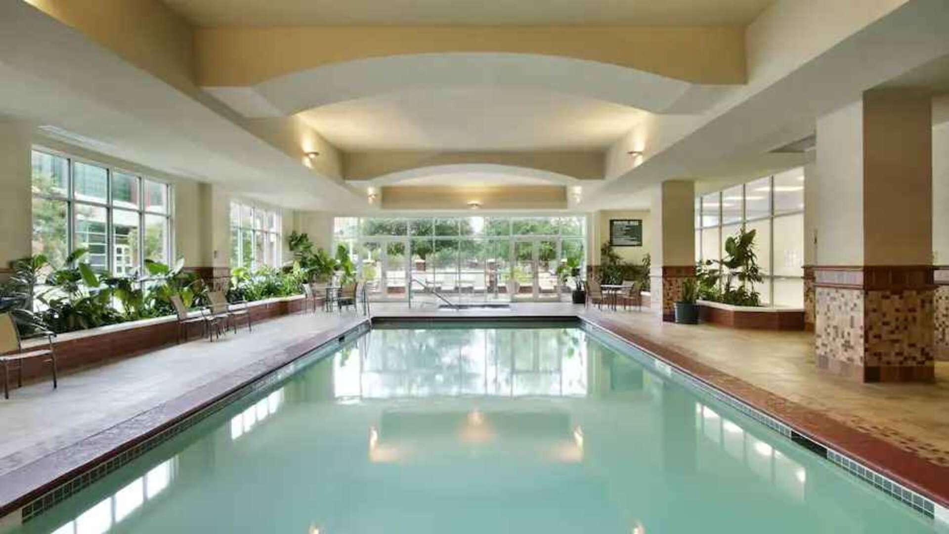 Relaxing indoor swimming pool at the Embassy Suites by Hilton Charleston Airport Convention Center.