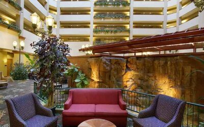 Comfortable workspace in a hotel lobby at the Embassy Suites by Hilton Charleston Airport Convention Center.