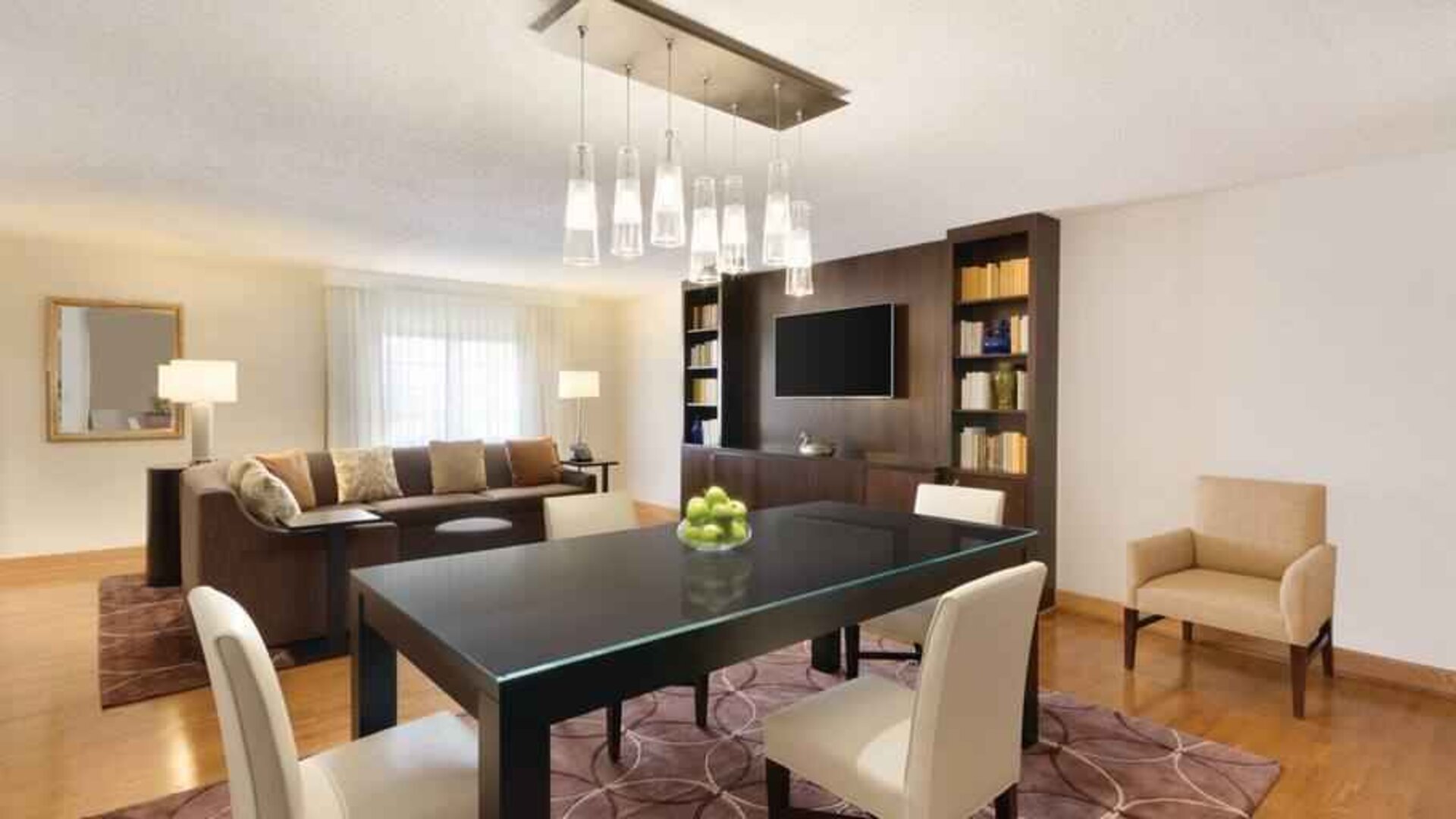Spacious living room with working station at the Embassy Suites by Hilton Greenville Golf Resort Conference Center