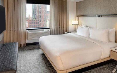 relaxing delux king room with TV at DoubleTree by Hilton Hotel & Suites Jersey City.