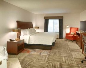 spacious delux king room with lounge area and work desk ideal for working remotely at Hilton Garden Inn Salt Lake City/Sandy.