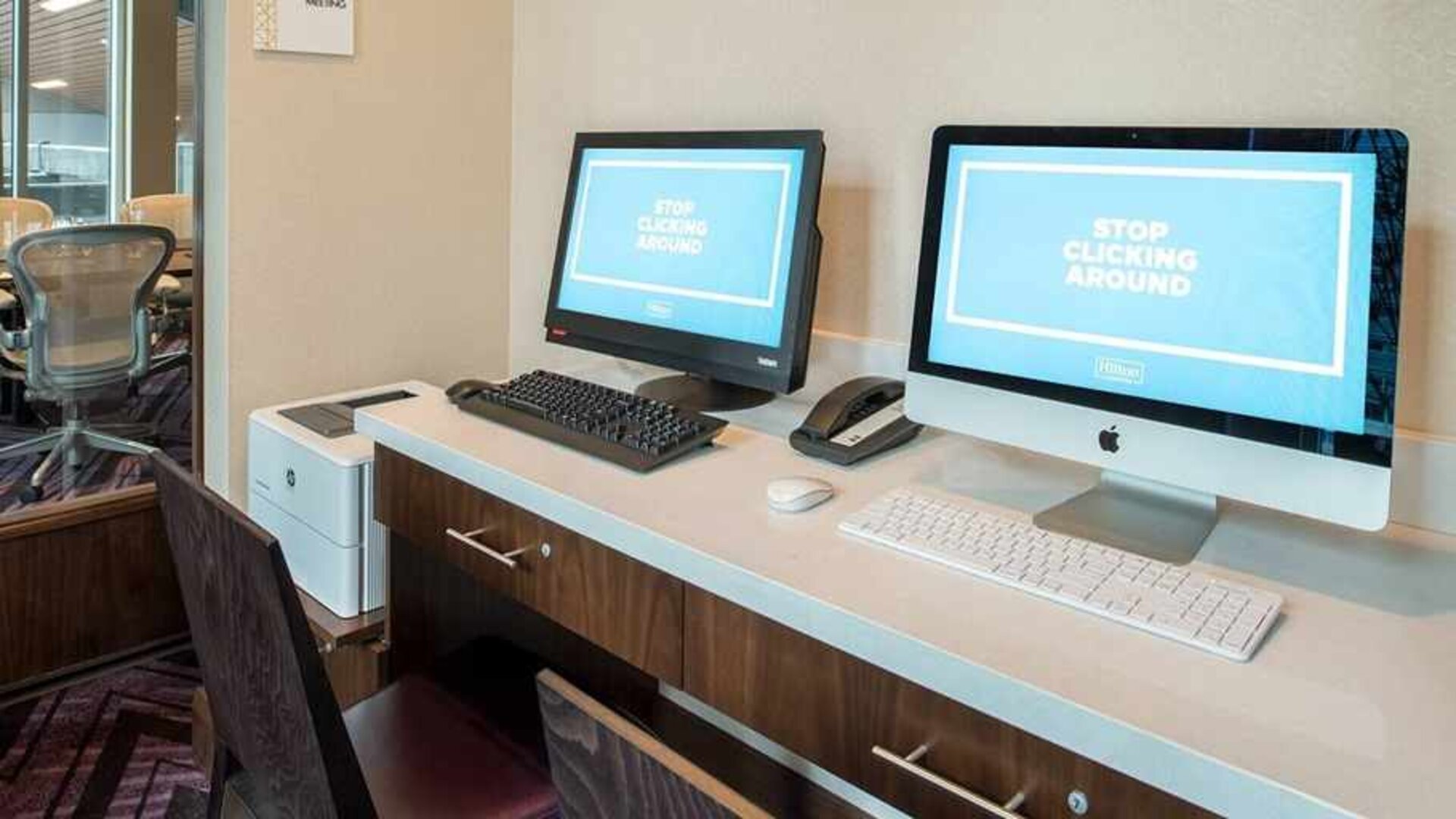 dedicated business center with printers, internet, and work desks ideal for working remotely at Embassy Suites by Hilton Seattle Downtown Pioneer Square.