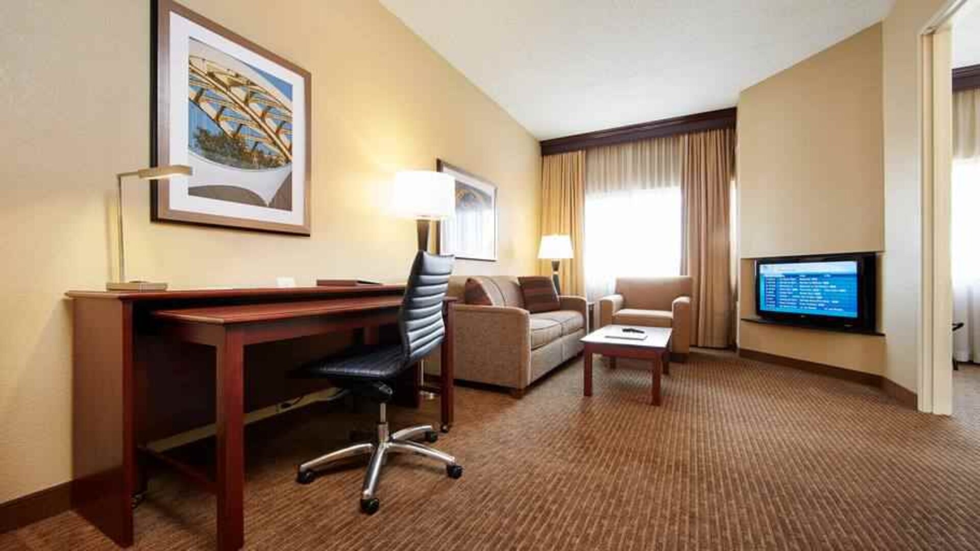 Working station in a hotel room at the DoubleTree Suites by Hilton Cincinnati-Blue Ash.