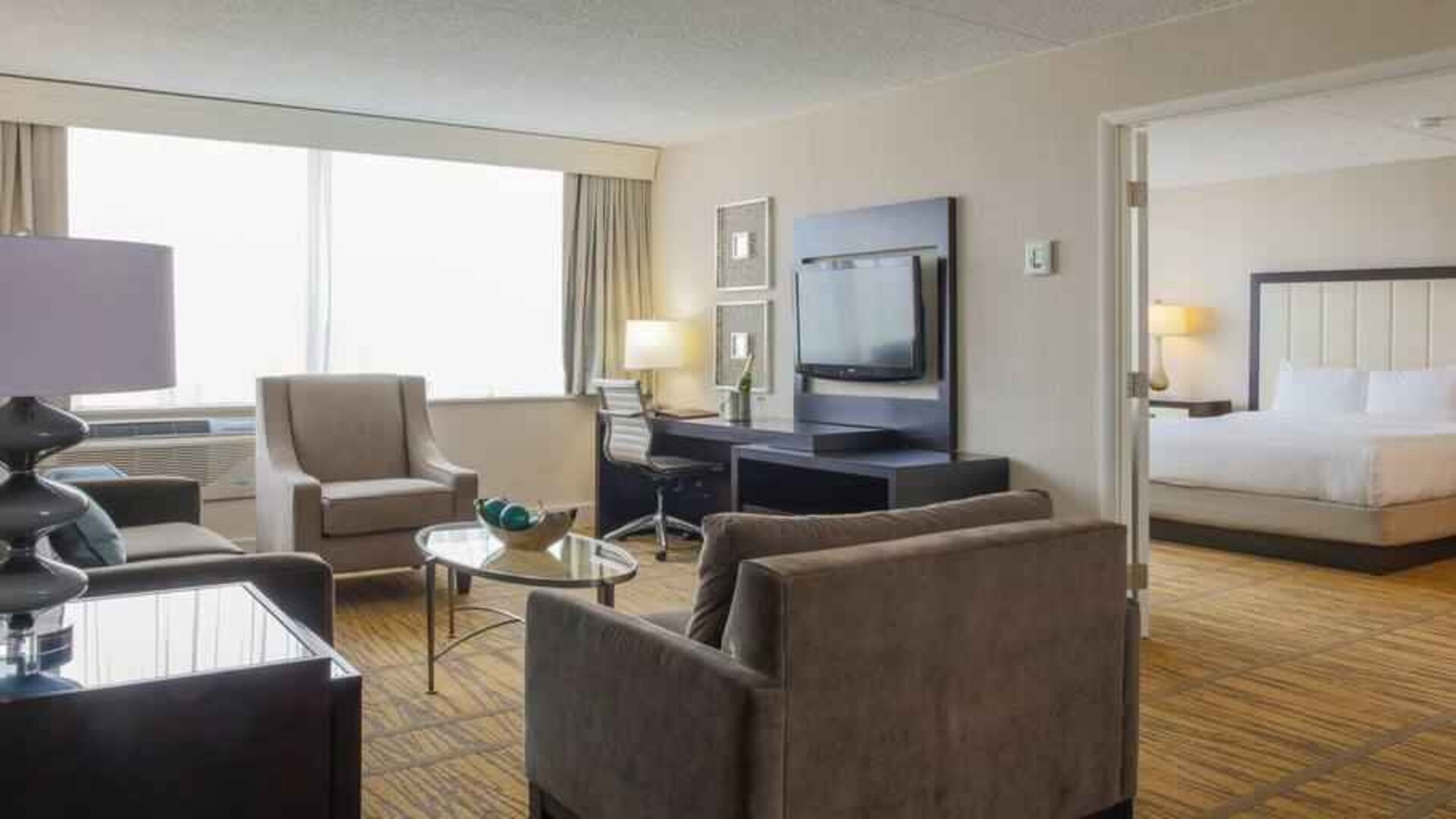 King suite with living room and bedroom at the DoubleTree by Hilton Rochester.