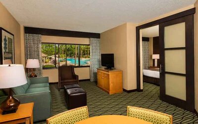 Spacious living room with working station at the DoubleTree Suites by Hilton Orlando - Disney Springs Area.