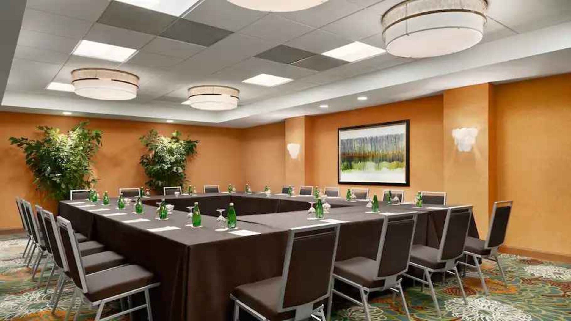 Meeting room with square conference table at the DoubleTree Suites by Hilton Orlando - Disney Springs Area.