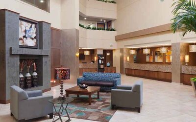 Comfortable lobby workspace with sofas at the DoubleTree Suites by Hilton Orlando - Disney Springs Area.