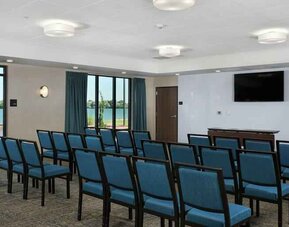 Meeting room with tables and screen at the Hampton Inn Burley.