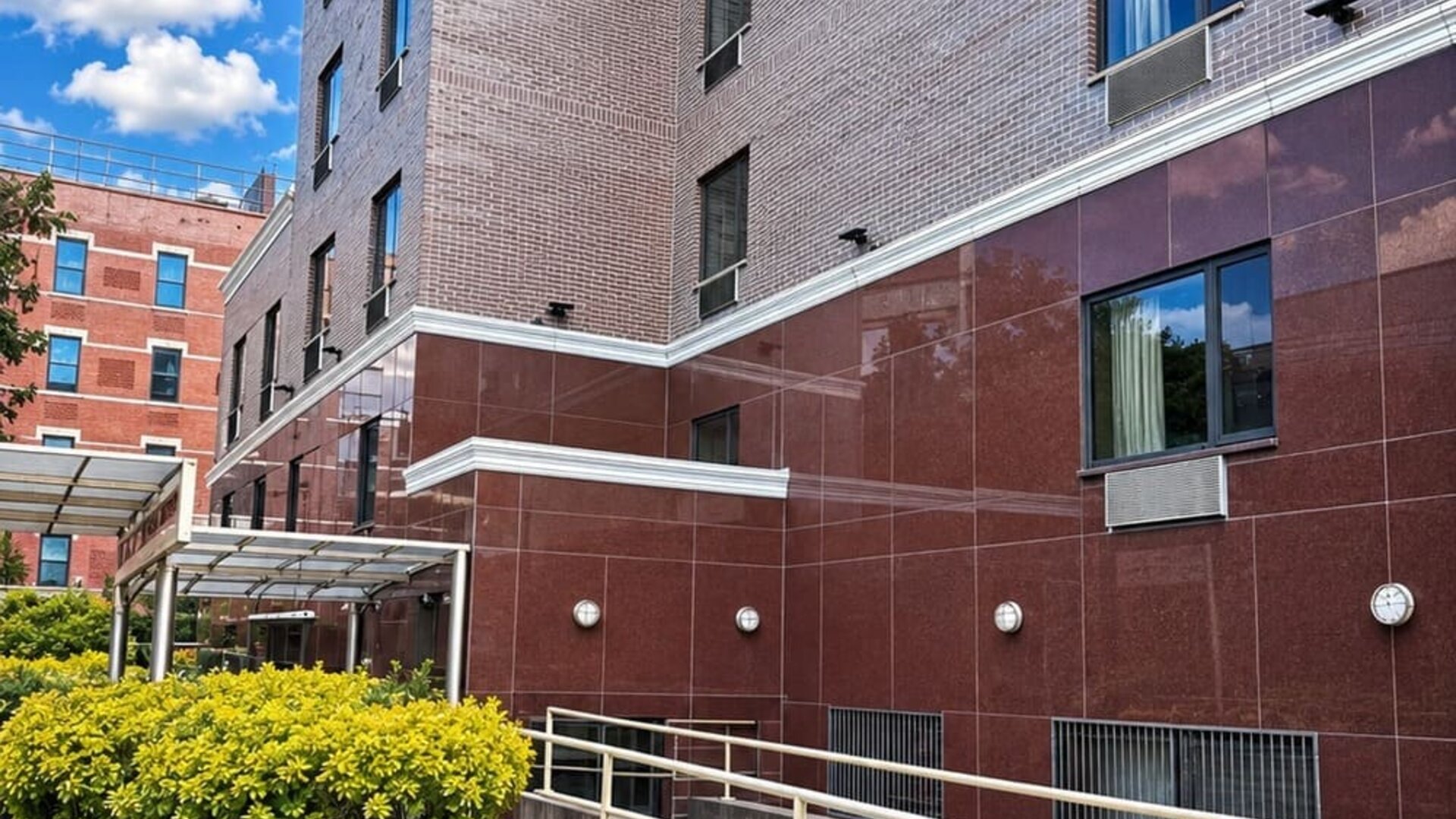 Reception and entrance area at Imperial Hotel featuring modern décor, polished flooring, guest service window, and direct access to the hotel's lobby and guest accommodations.