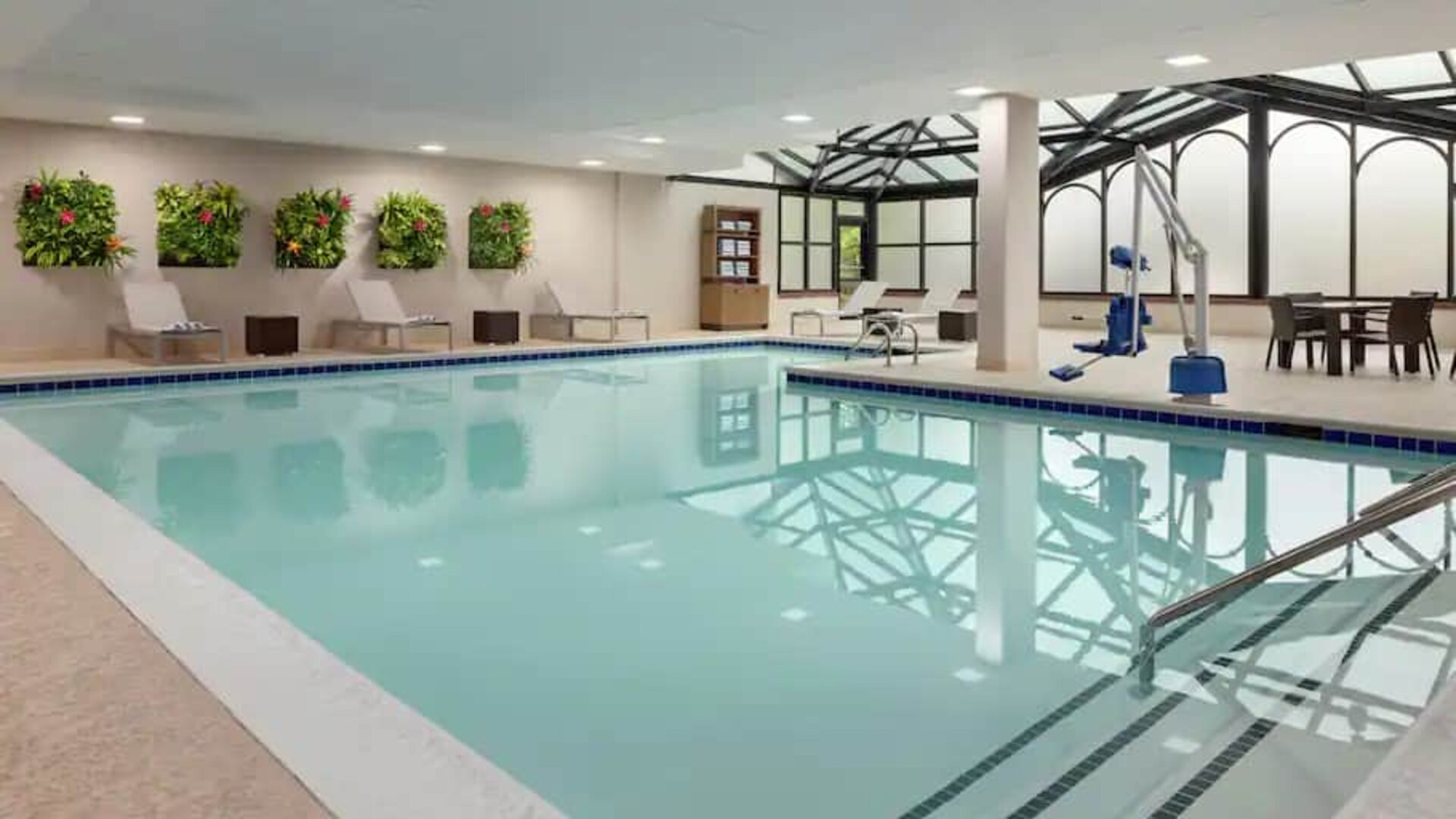 Spacious indoor pool with floral design at the Embassy Suites by Hilton Atlanta Alpharetta