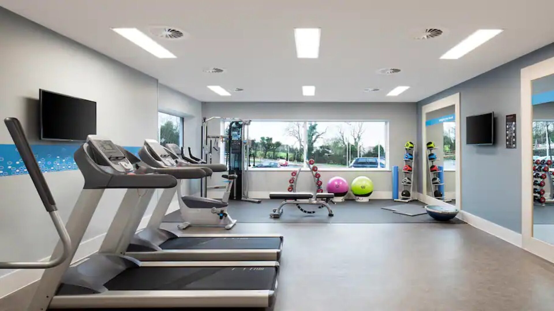 Fitness center with treadmills at the Hampton by Hilton Bristol Airport.
