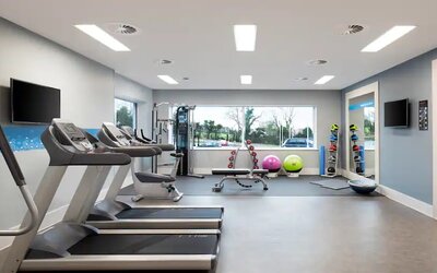 Fitness center with treadmills at the Hampton by Hilton Bristol Airport.