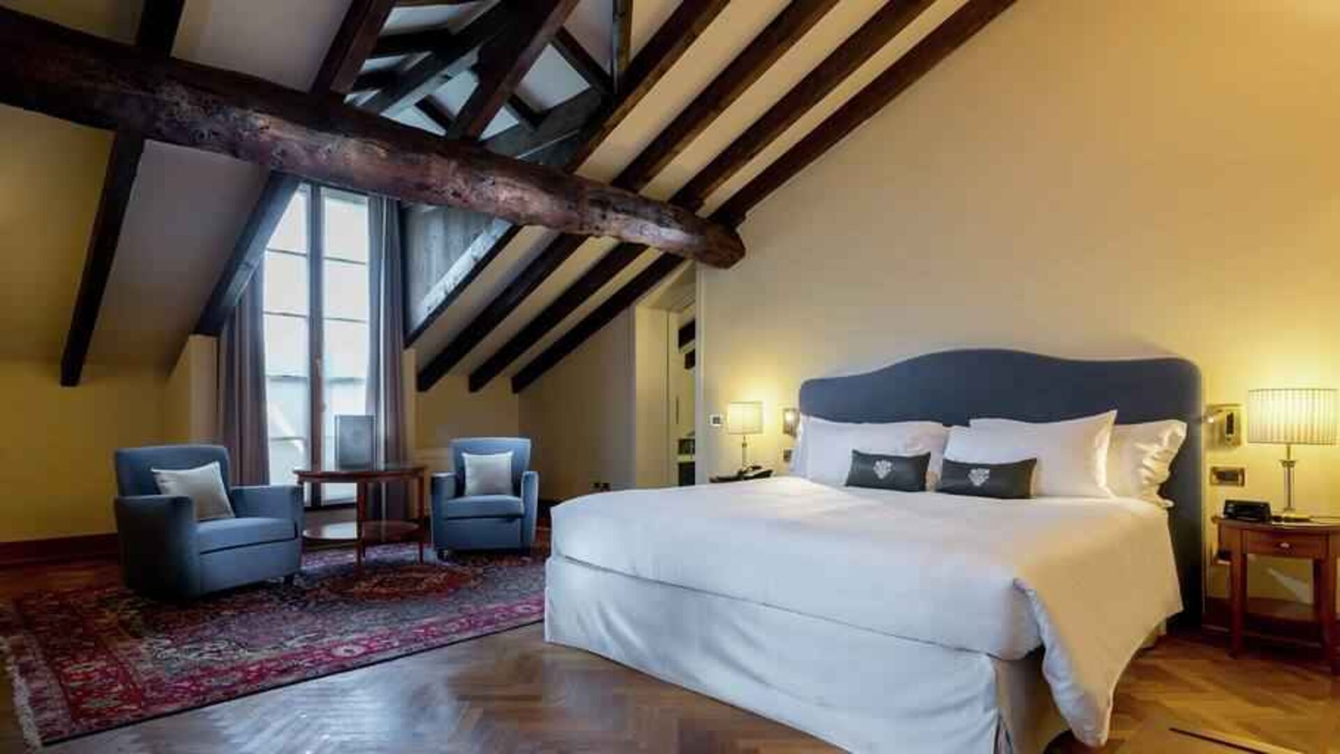Bright and spacious king bedroom at the Grand Hotel Villa Torretta Milan Sesto, Curio Collection.