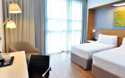 Twin room with working station at the Hilton Garden Inn Milan North.