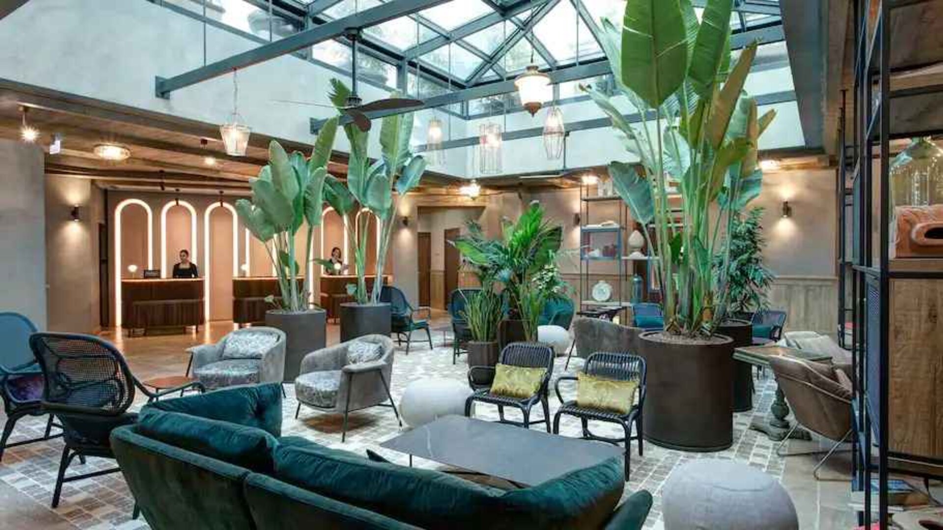 Beautiful lobby workspace with plants at the DoubleTree by Hilton Rome Monti.