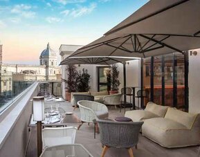 Beautiful outdoor terrace overlooking the city at the DoubleTree by Hilton Rome Monti.