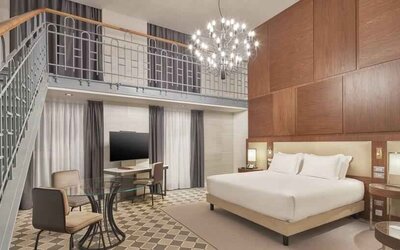 Spacious king suite with working station at the DoubleTree by Hilton Trieste.