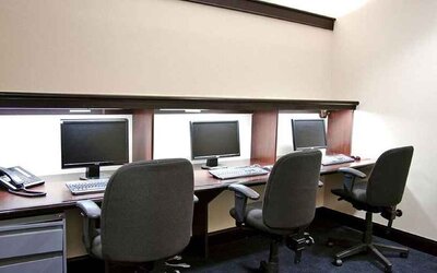 Professional business center with PC, phone, work desks, and printer ideal for working remotely at DoubleTree by Hilton Hotel Downtown Wilmington - Legal District.