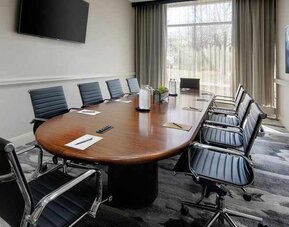 professional, bright-lit meeting room at Embassy Suites by Hilton Detroit Troy Auburn Hills.
