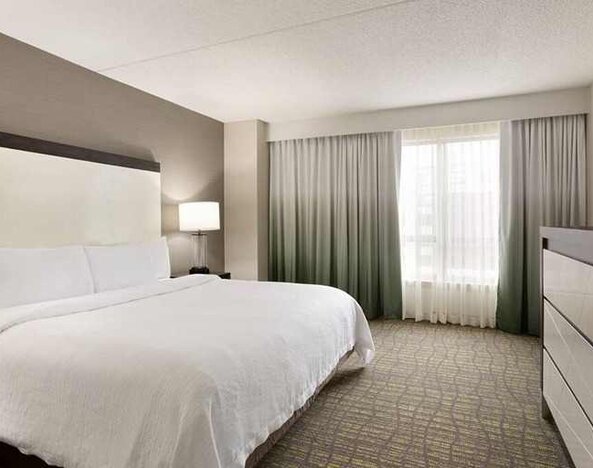 spacious king suite with TV at Embassy Suites by Hilton Newark Wilmington South.