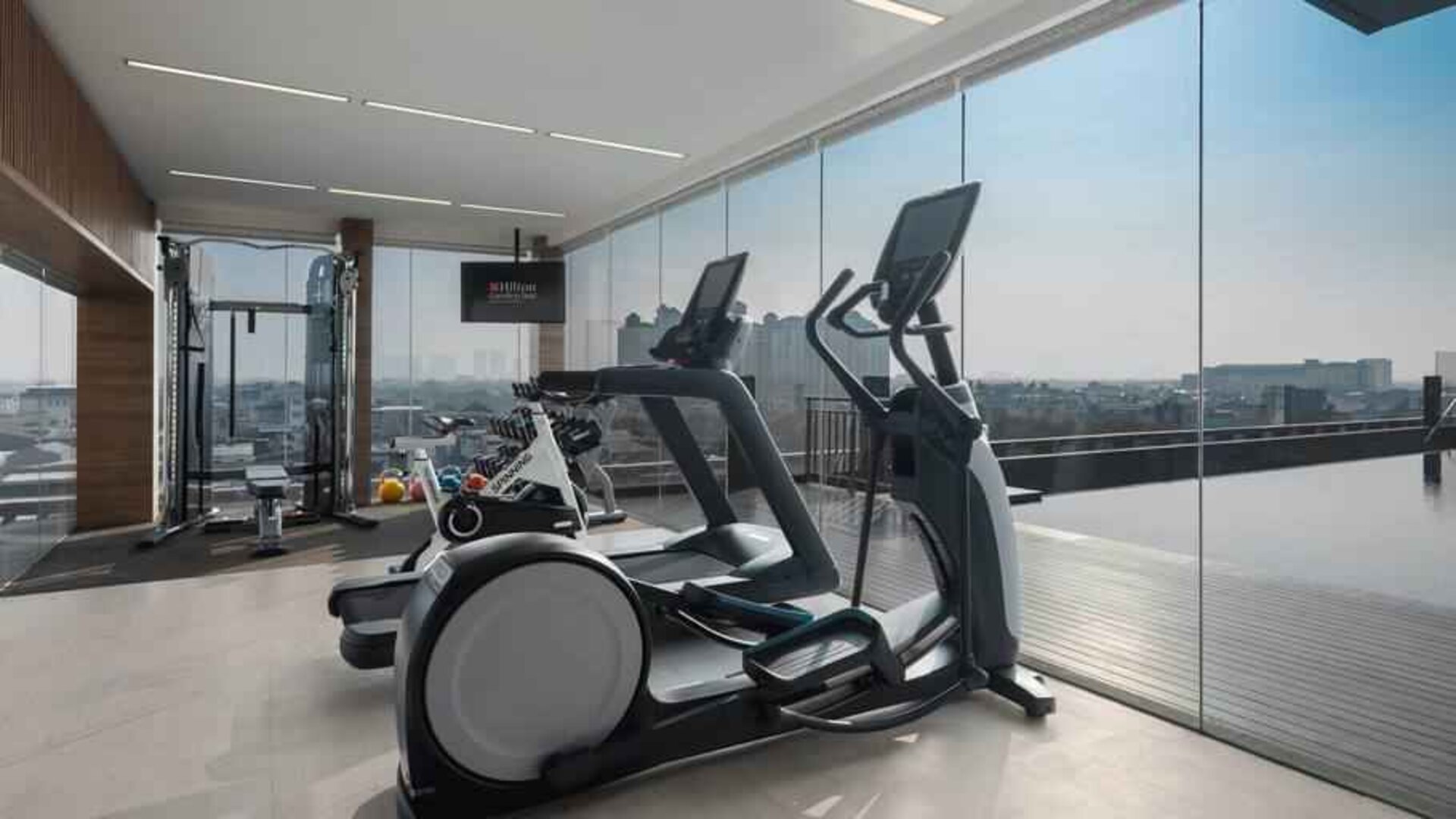 Fitness center with treadmills at the Hilton Garden Inn Jakarta Taman Palem.