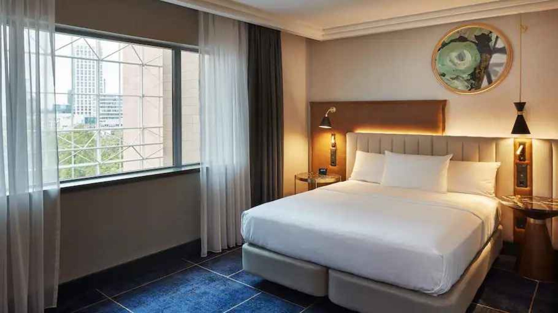 Comfortable hotel room with window at the Hilton Frankfurt City Centre.