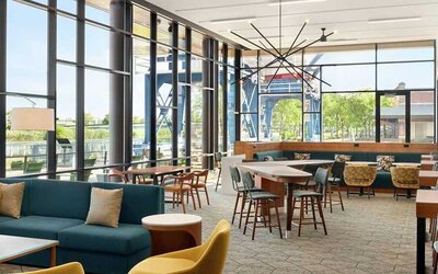 comfortable and bright-lit lounge and coworking space at Homewood Suites by Hilton Wilmington Downtown.