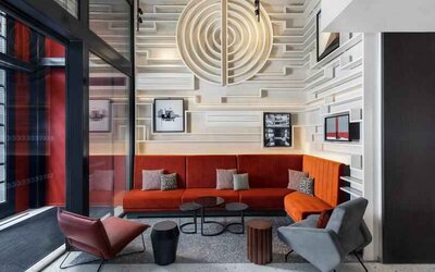 Comfortable hotel workspace with sofas at the Canopy by Hilton Paris Trocadero.