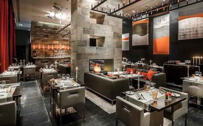 Elegant restaurant with fireplace at the Hilton Evian-les-Bains.