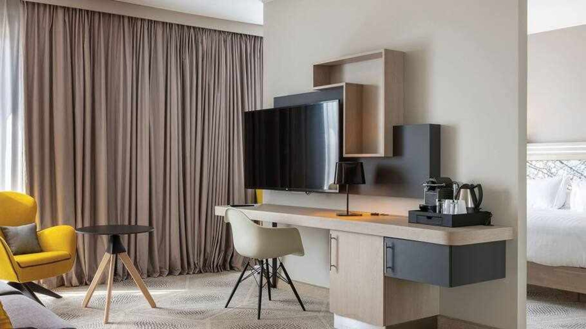 Spacious living room with working station at the Hilton Garden Inn Tours Centre.