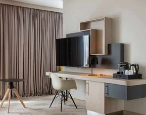Spacious living room with working station at the Hilton Garden Inn Tours Centre.